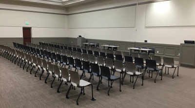 Community Rooms A & B configured for an event with tables and A/V