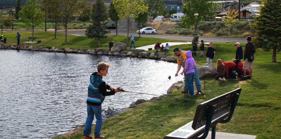 People fishing at a pond